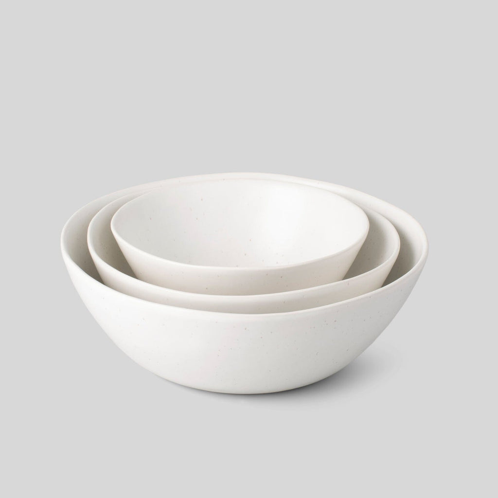 http://us.fable.com/cdn/shop/products/the-nested-serving-bowls-dinnerware-fable-home-speckled-white-889532_1024x1024.jpg?v=1698261276