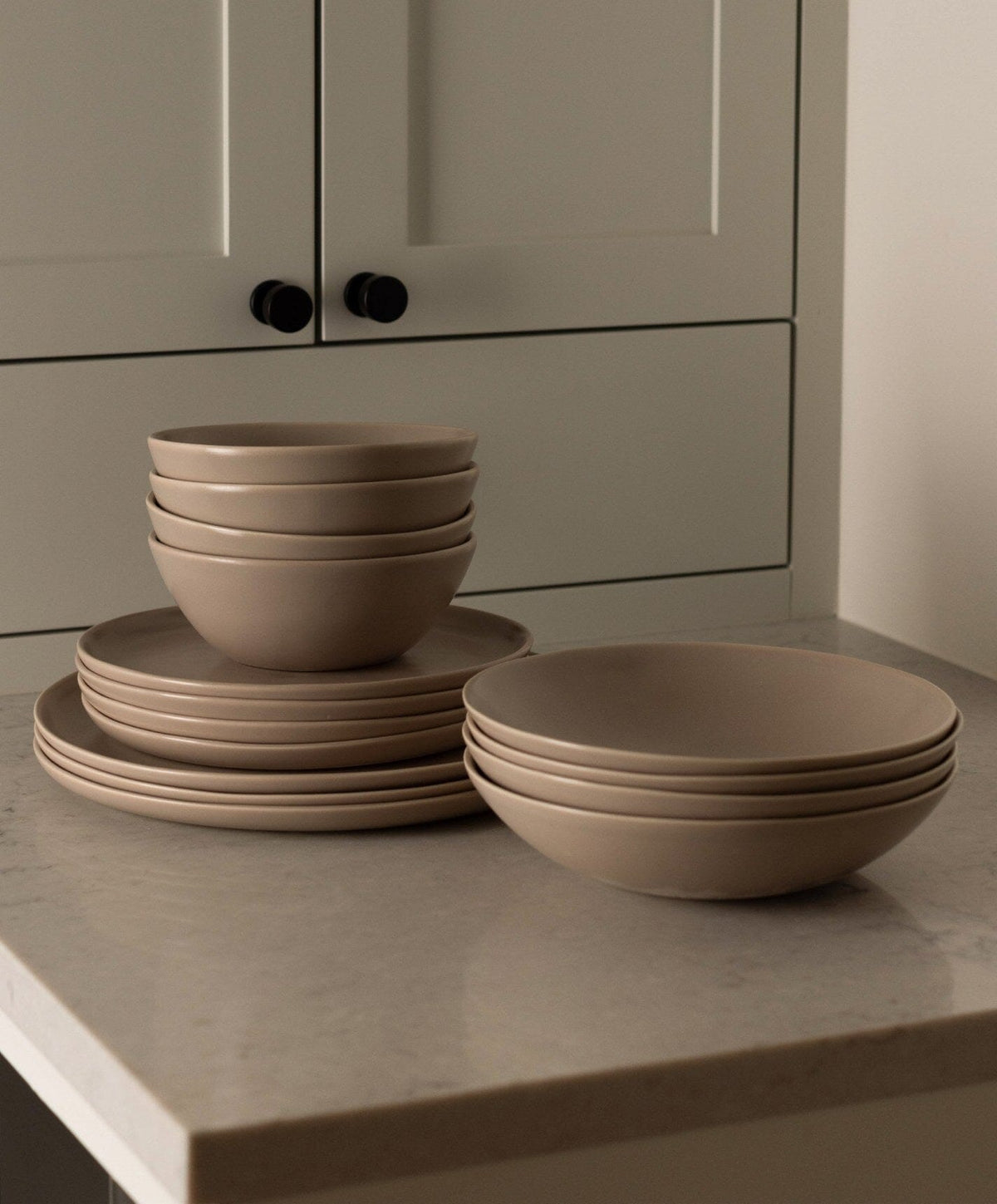 Complete Dinnerware Set by Fable Home, shown in Desert Taupe.