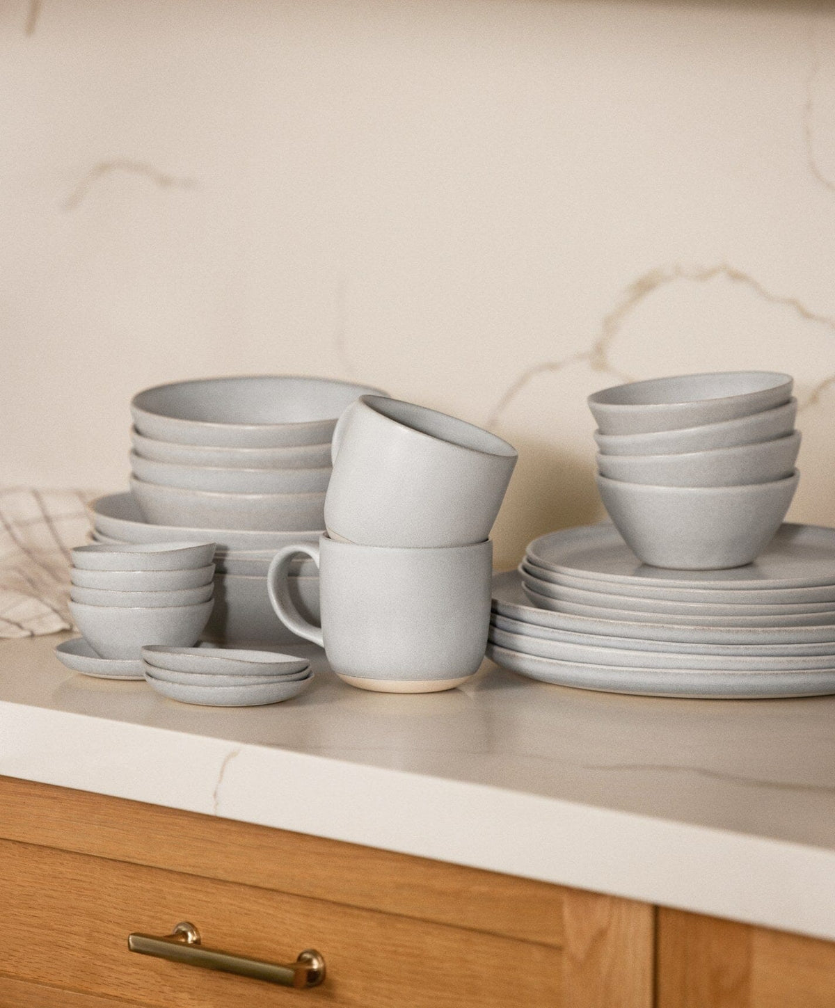 Complete Dinnerware Set by Fable Home, shown in Stone Blue.