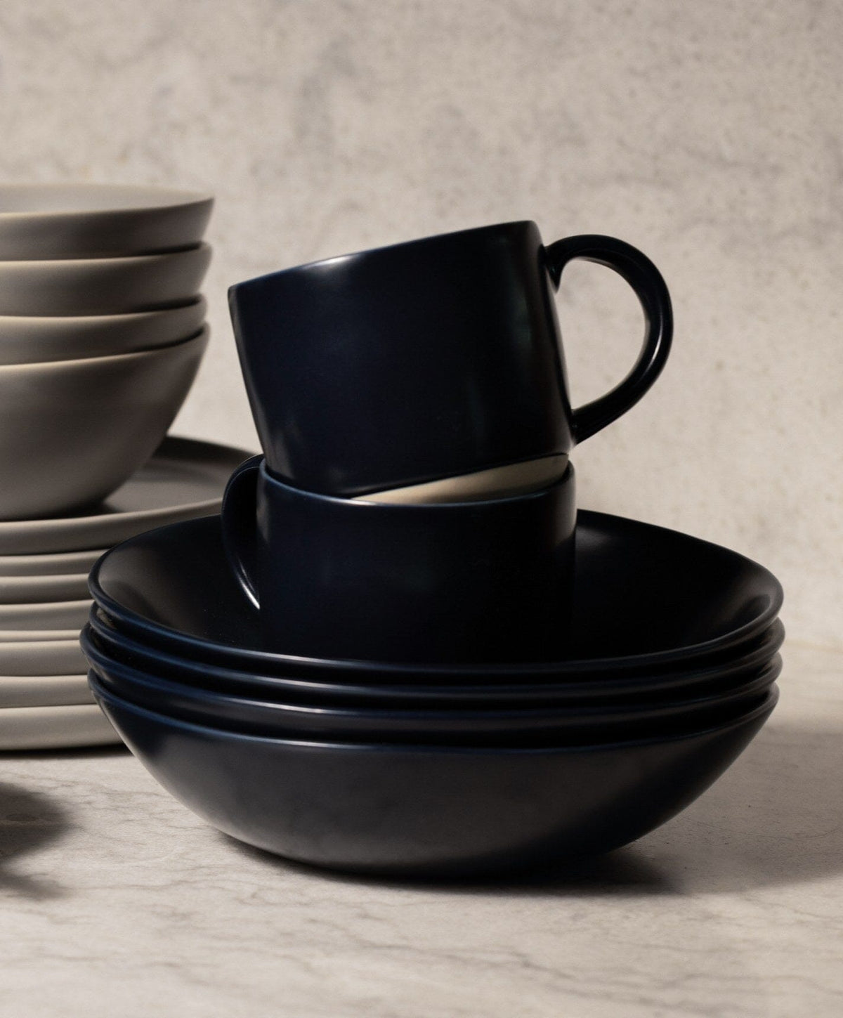 Complete Dinnerware Set by Fable Home, shown in Midnight Blue.