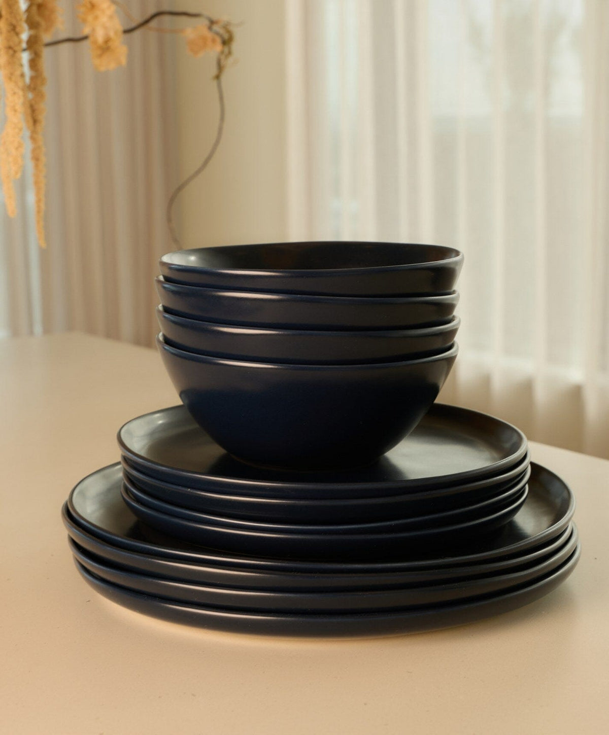 Complete Dinnerware Set by Fable Home, shown in Midnight Blue.