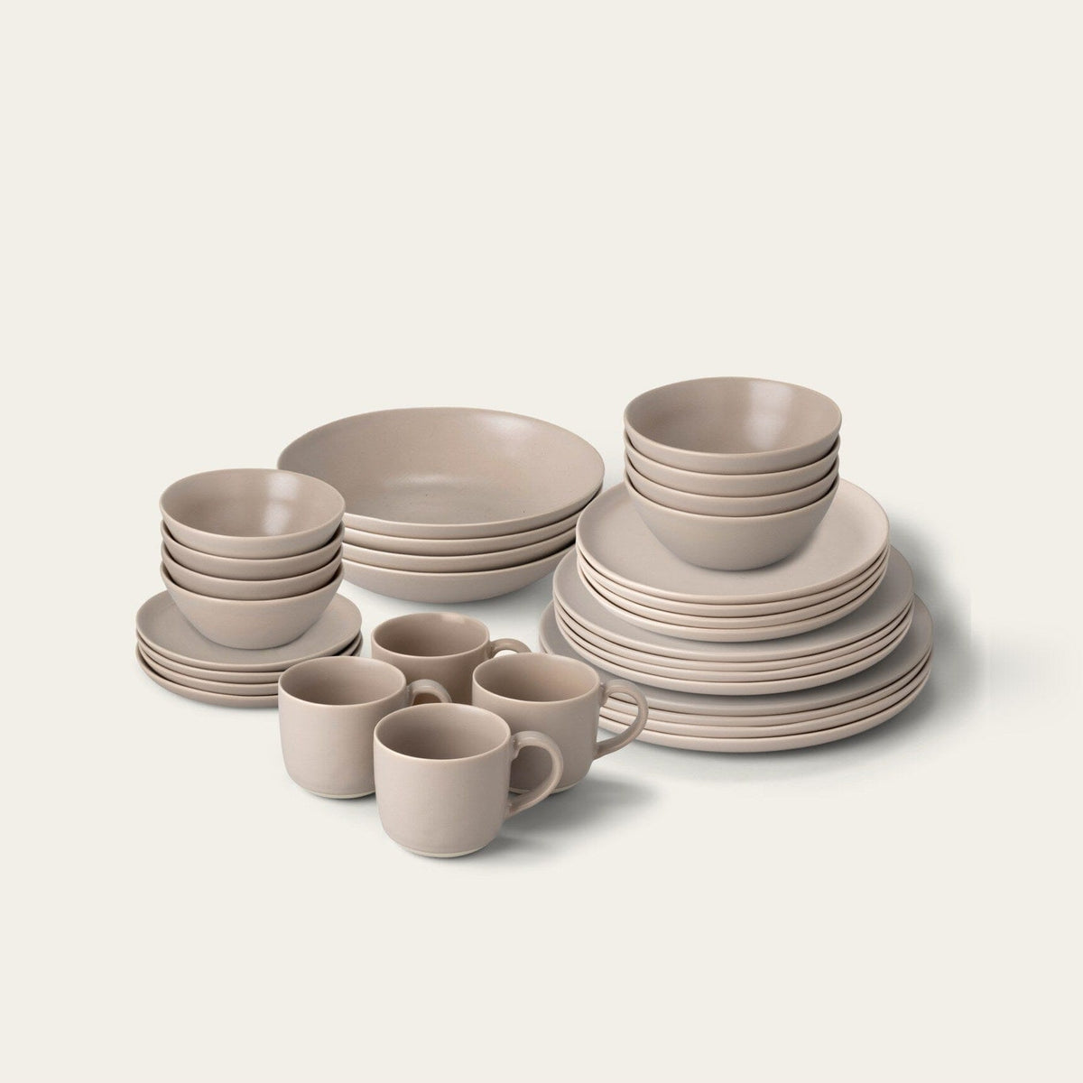 Complete Dinnerware Set by Fable Home, shown in Desert Taupe.