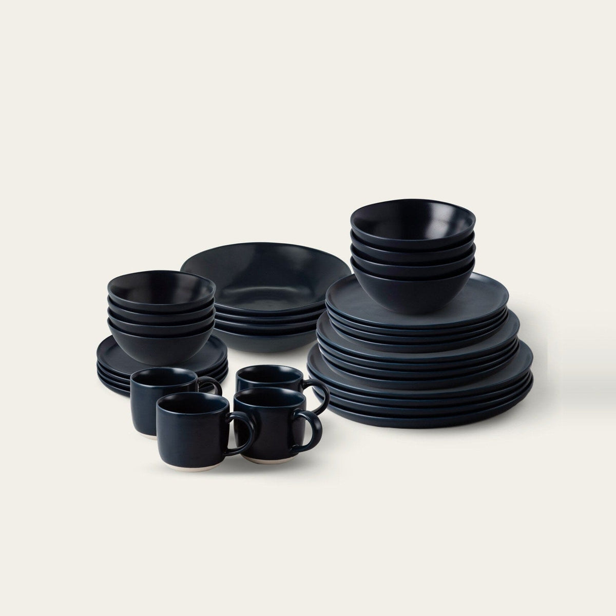 Complete Dinnerware Set by Fable Home, shown in Midnight Blue.