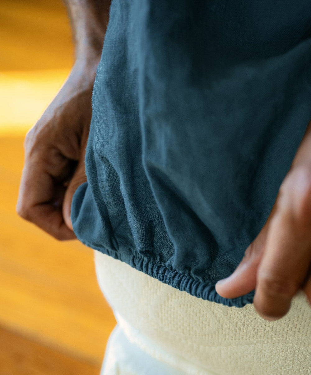 Linen Fitted Sheet by Fable Home, shown in Storm Blue.