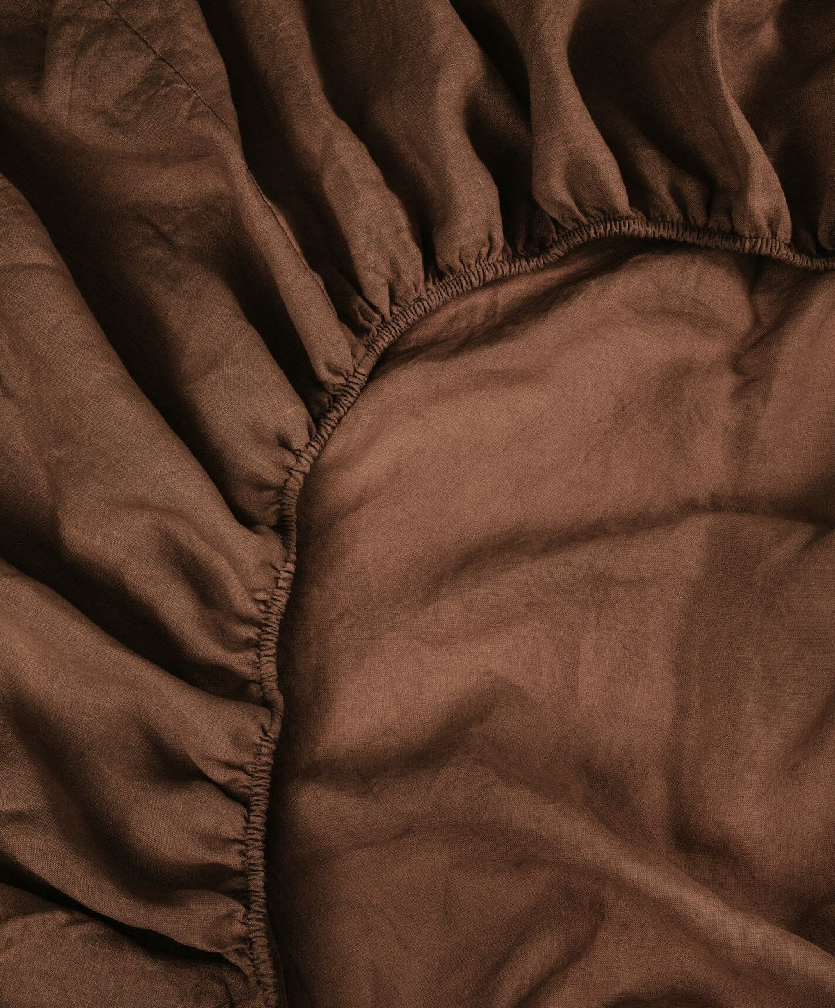 Linen Fitted Sheet by Fable Home, shown in Walnut Brown.
