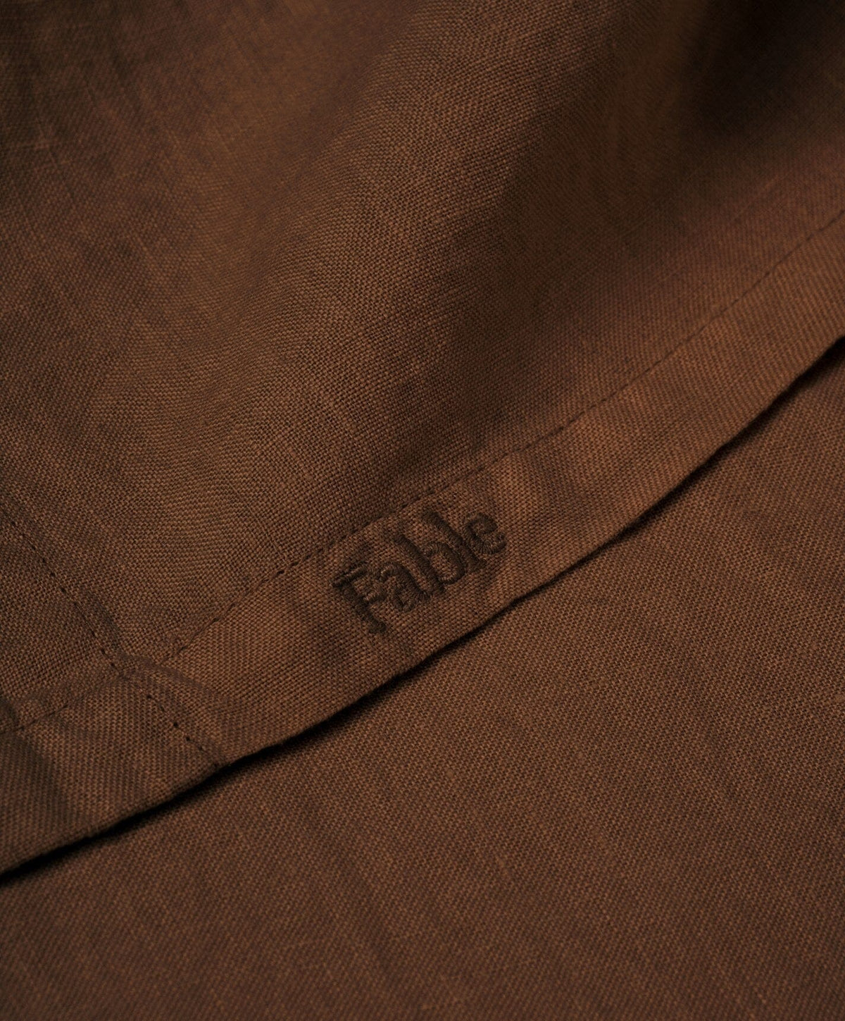 Linen Flat Sheet by Fable Home, shown in Walnut Brown.