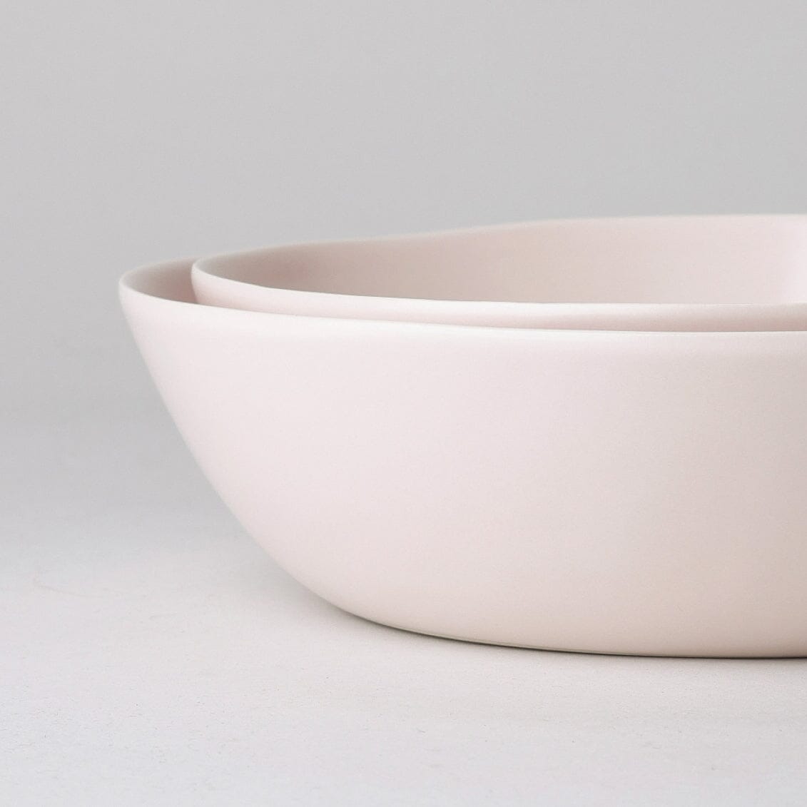 Low serving bowls serveware by Fable Home, shown in a blushpink finish.
