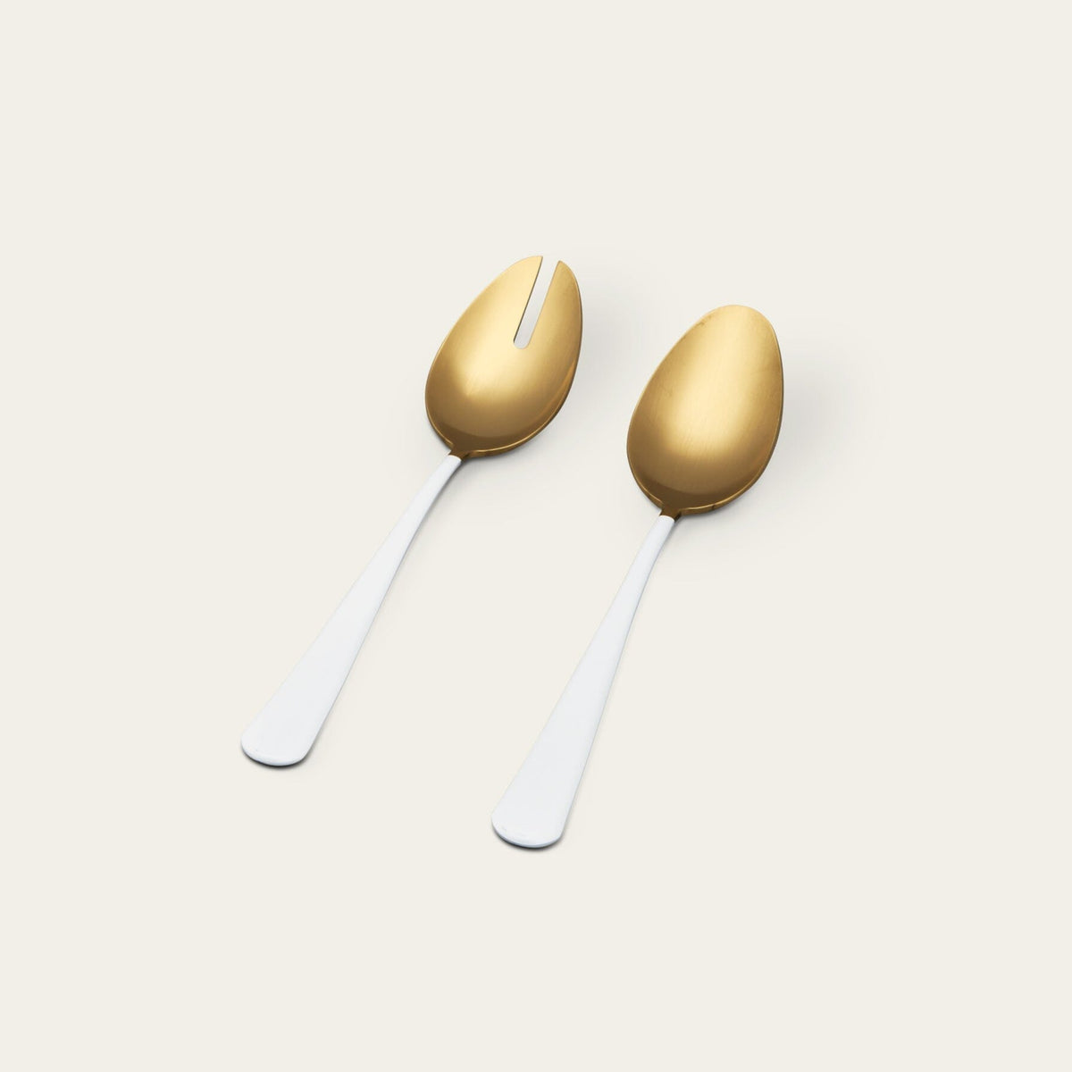 Serving spoons flatware by Fable Home, shown in a goldandwhite finish.