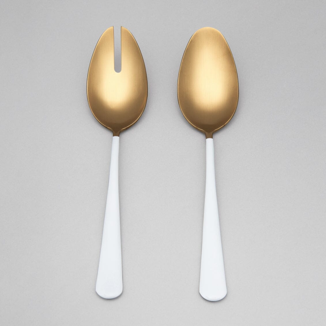 Serving spoons flatware by Fable Home, shown in a goldandwhite finish.