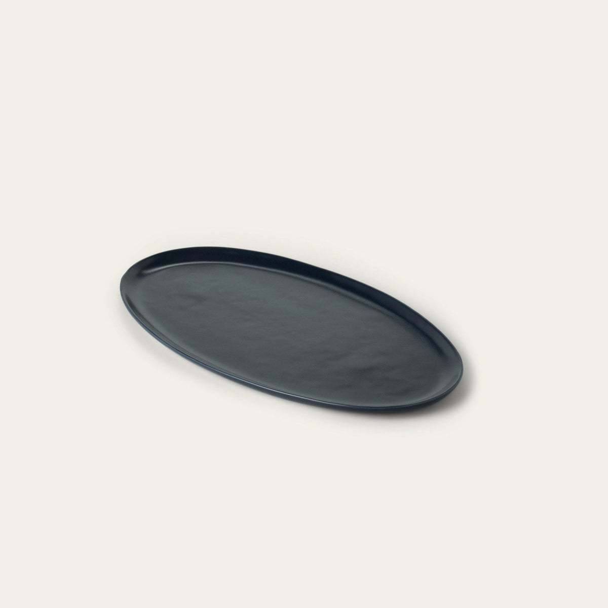 Oval Serving Platter by Fable Home, shown in Midnight Blue.