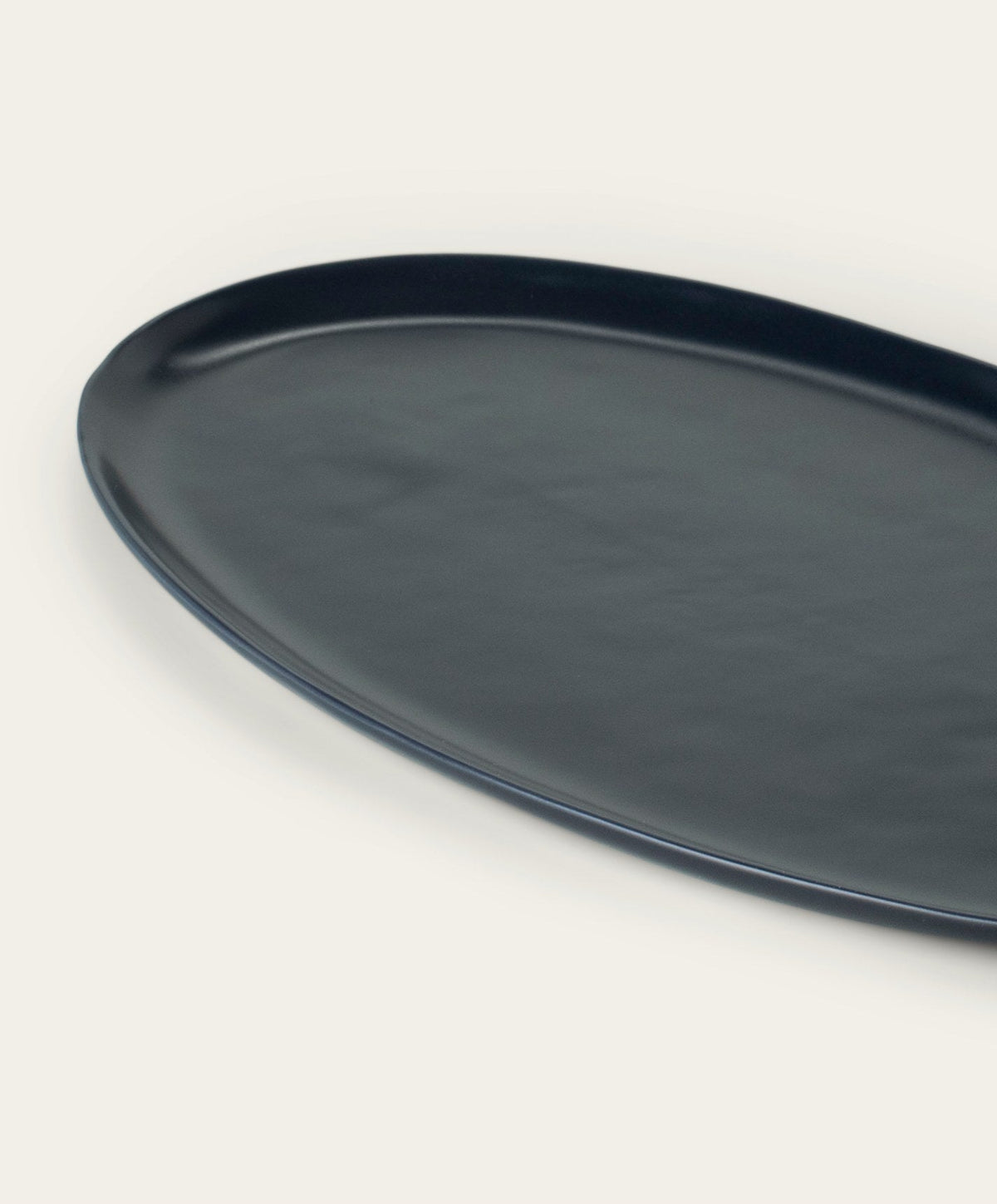 Oval Serving Platter by Fable Home, shown in Midnight Blue.