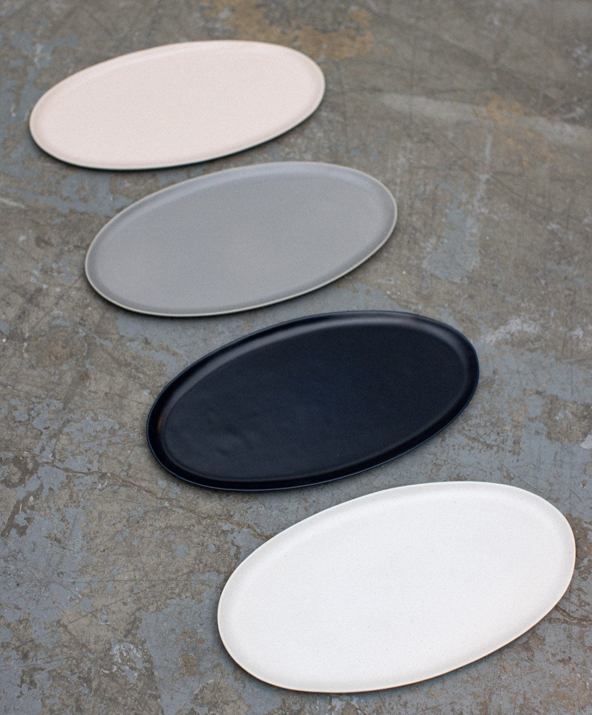 Oval Serving Platter by Fable Home, shown in Midnight Blue.