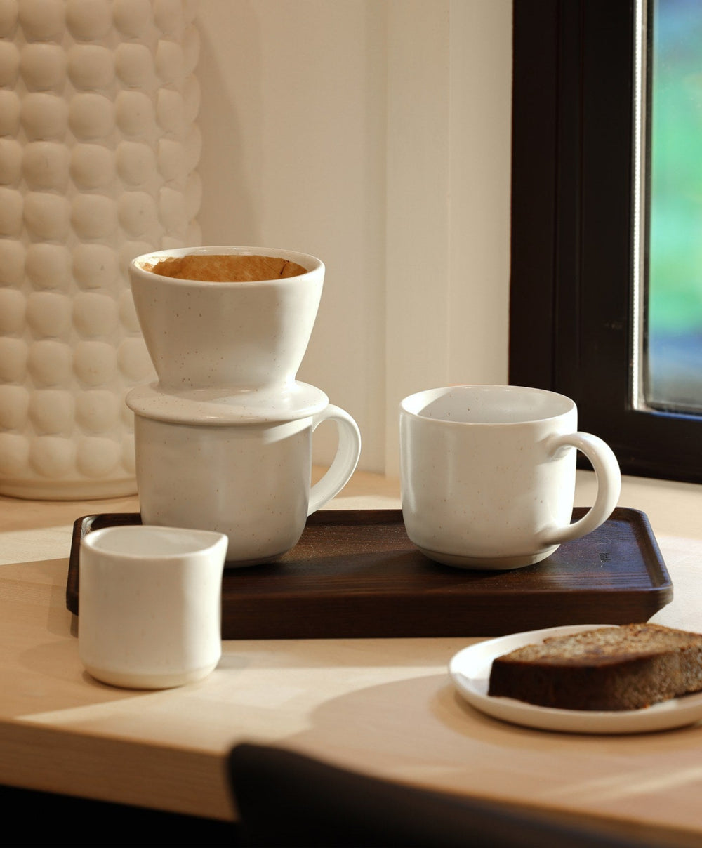 Small Carafe by Fable Home, shown in Speckled White and Beachgrass Green.