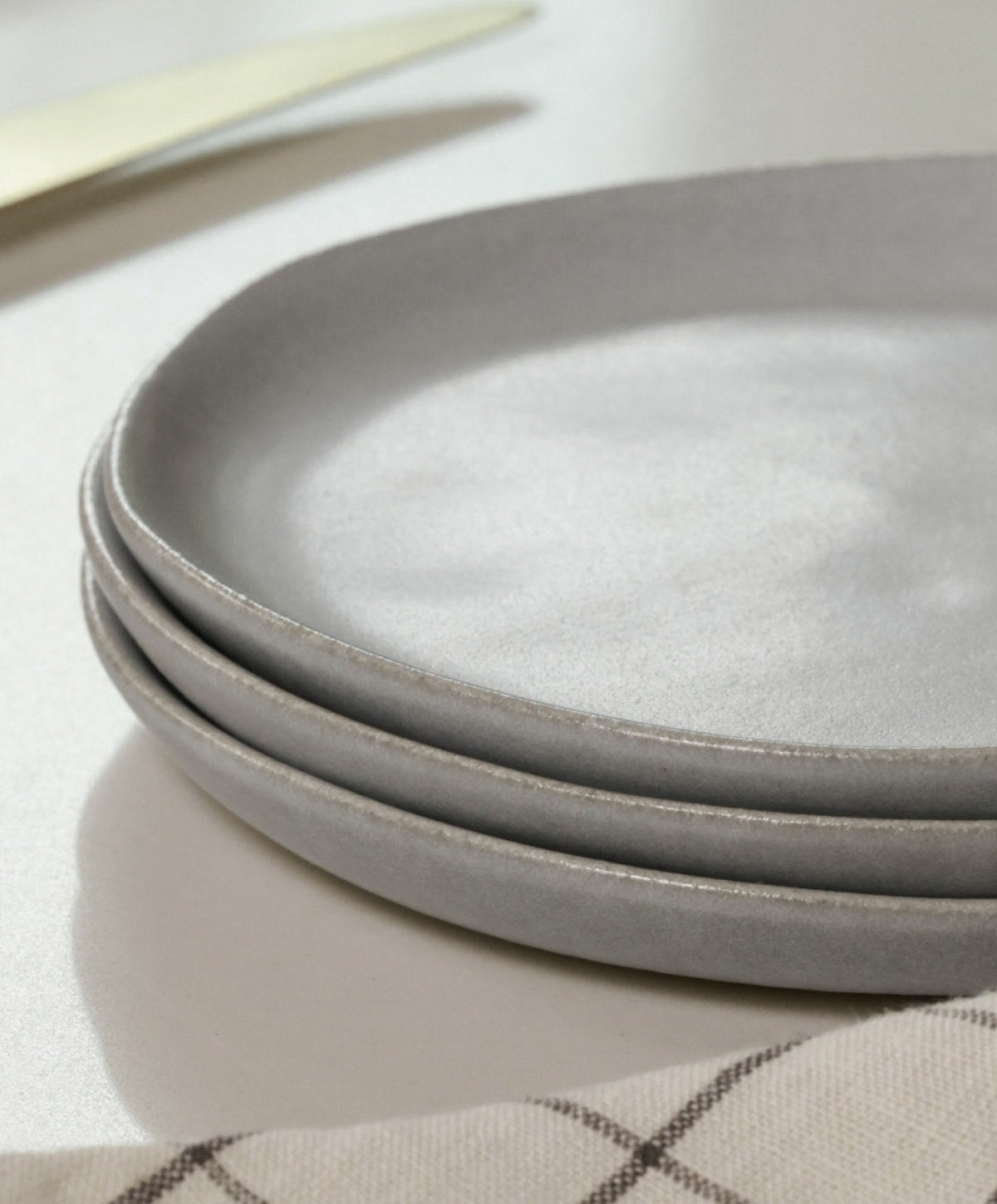 Dinner Plates by Fable Home, shown in Stone Blue.