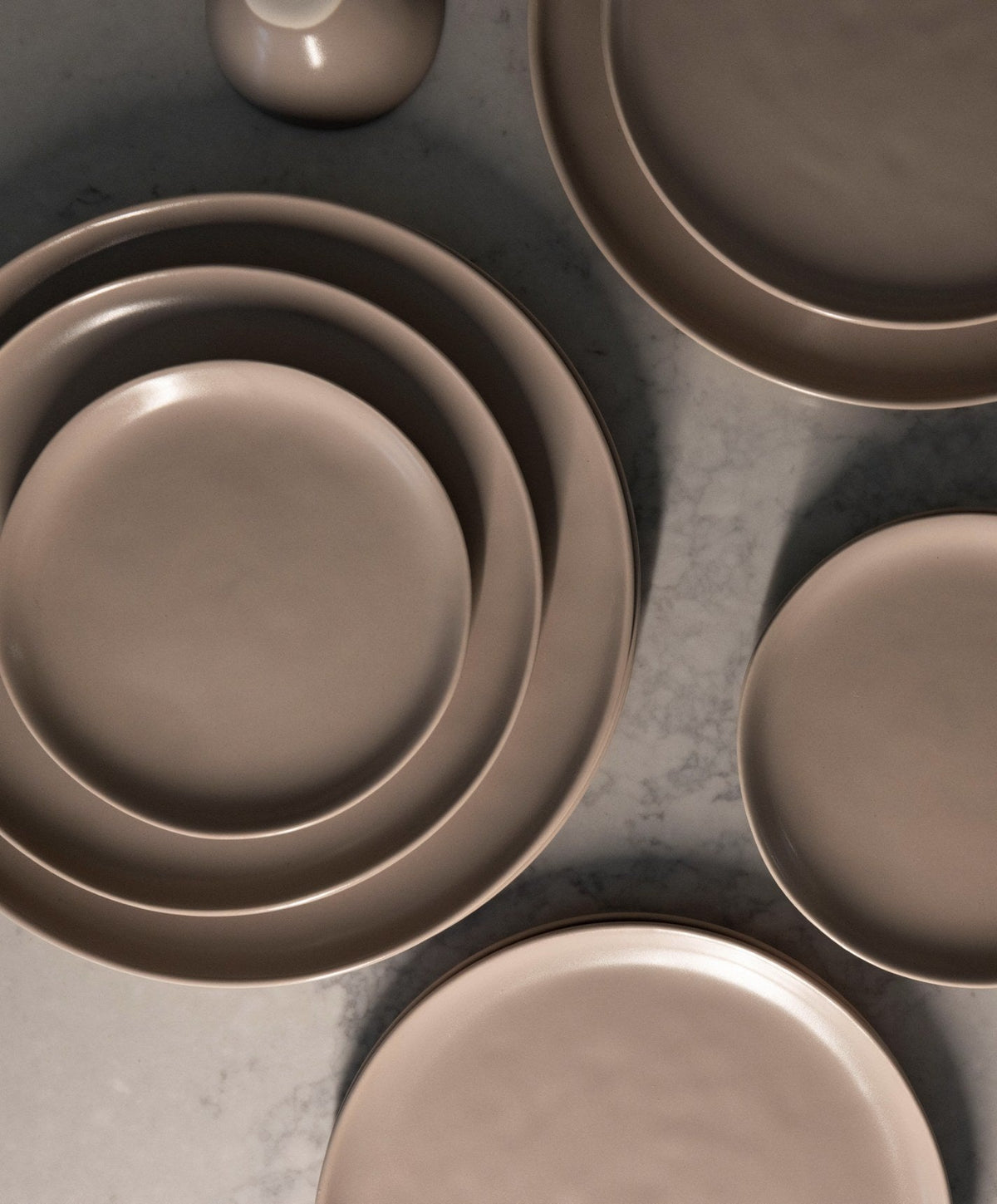 Dinner Plates by Fable Home, shown in Desert Taupe.