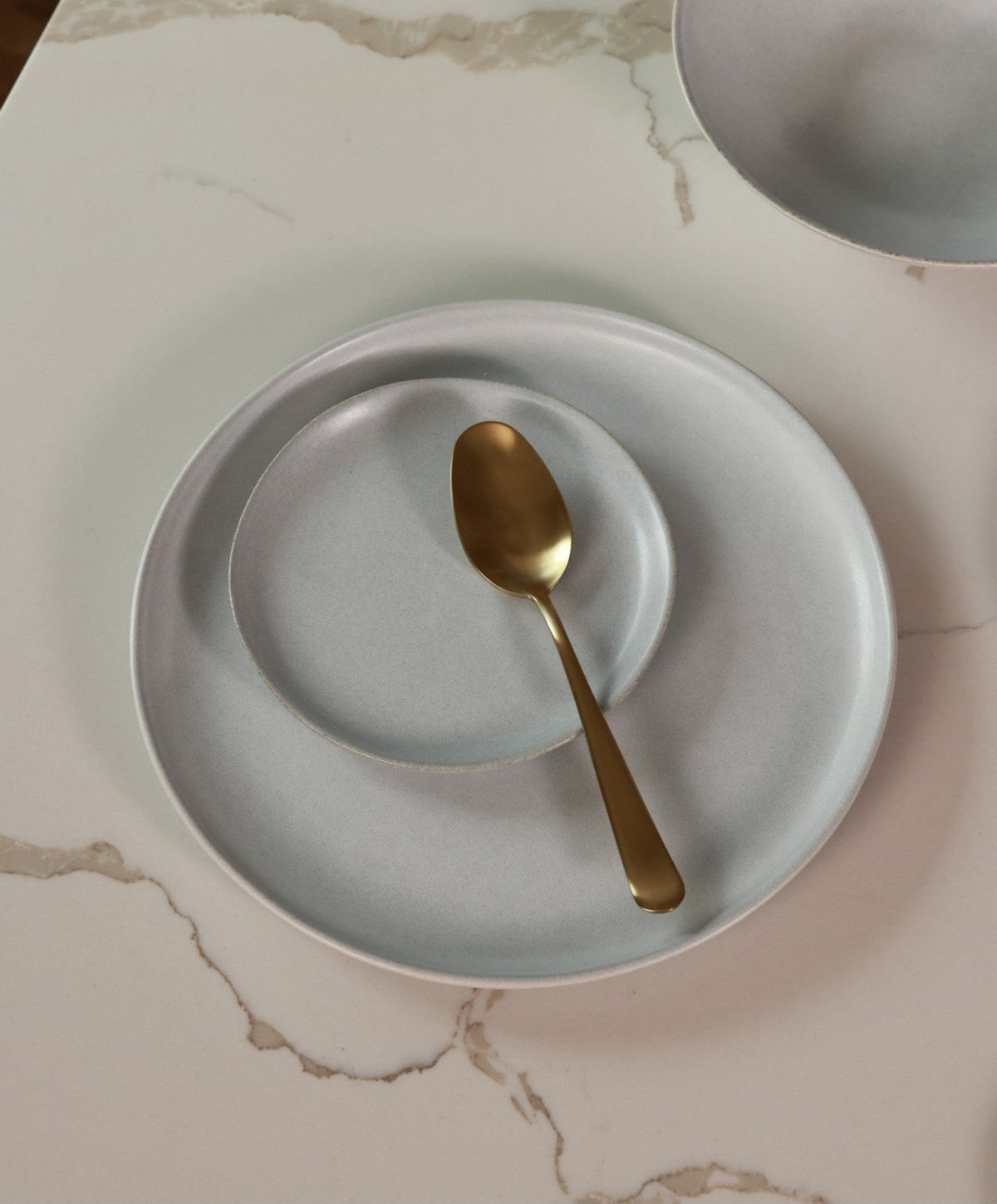 Dessert Plates by Fable Home, shown in Stone Blue.