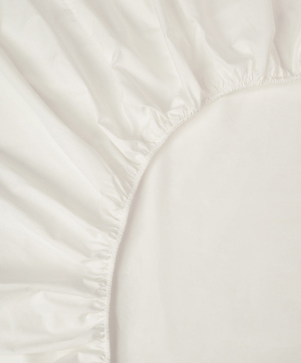Percale Fitted Sheet by Fable Home, shown in Shell White.