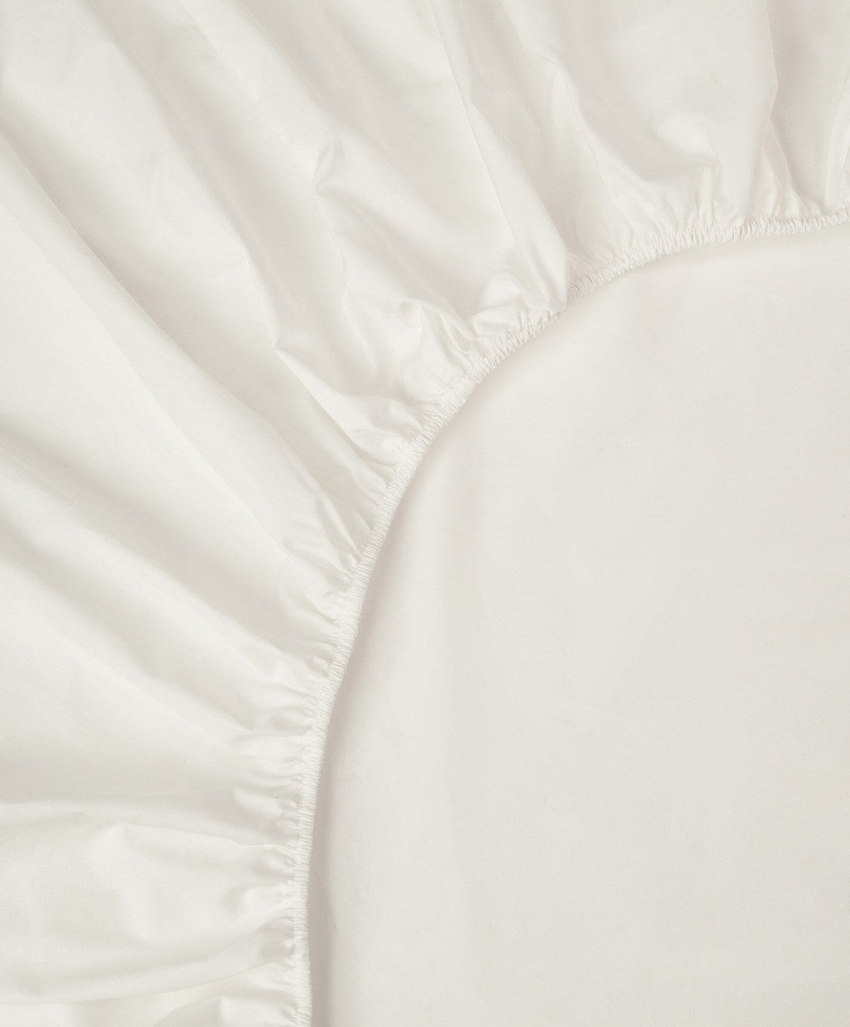 Percale Fitted Sheet by Fable Home, shown in Shell White.