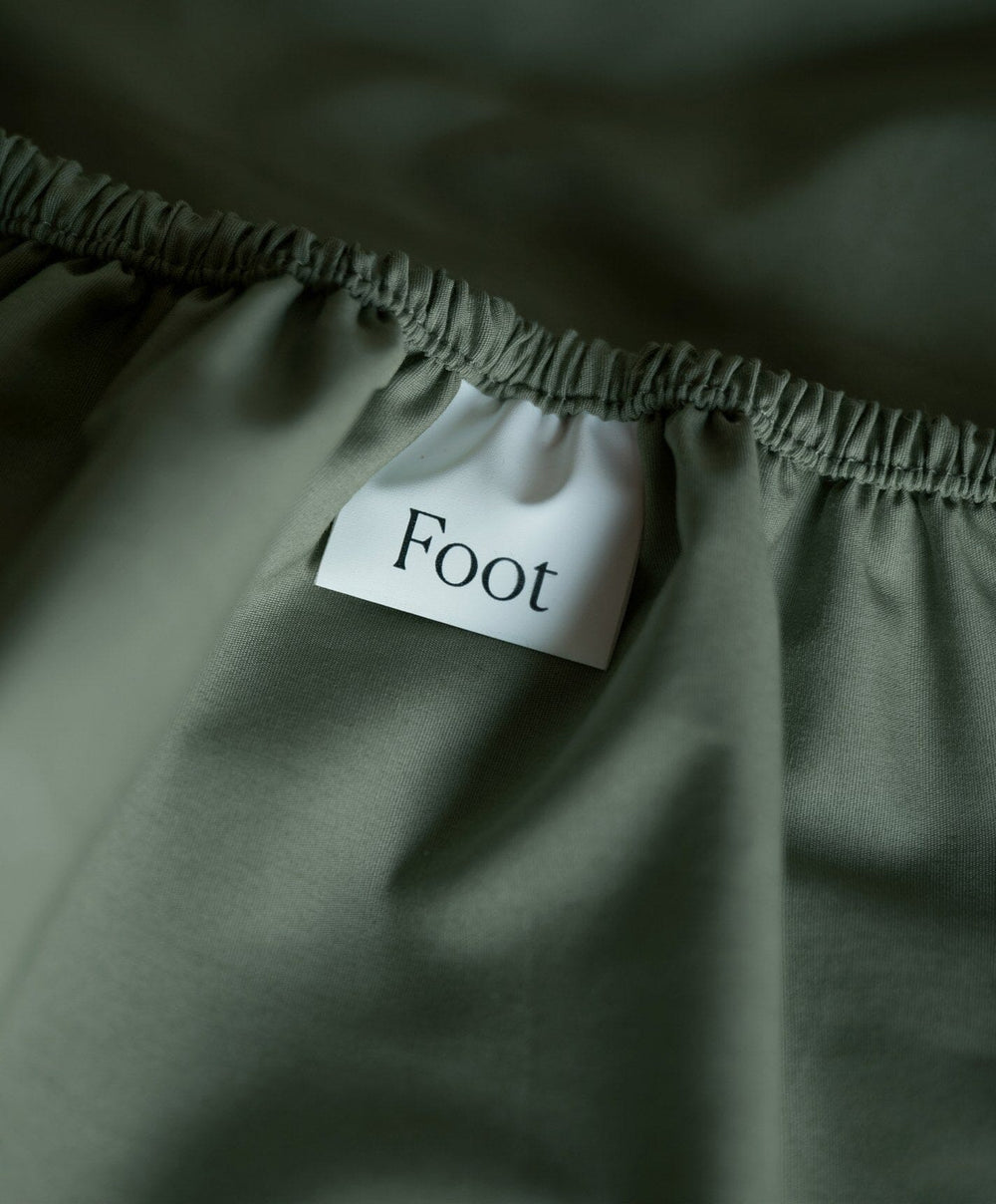 Percale Fitted Sheet by Fable Home, shown in Juniper Green.