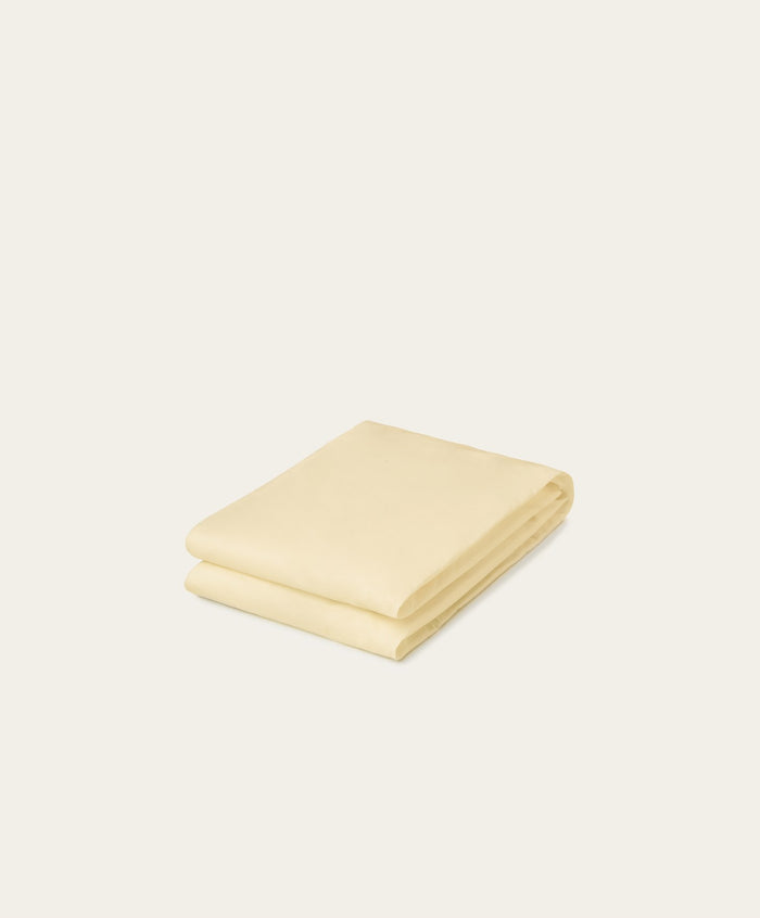 Percale Fitted Sheet by Fable Home, shown in Buttercup Yellow. – #buttercupyellow/full #buttercupyellow/queen #buttercupyellow/king