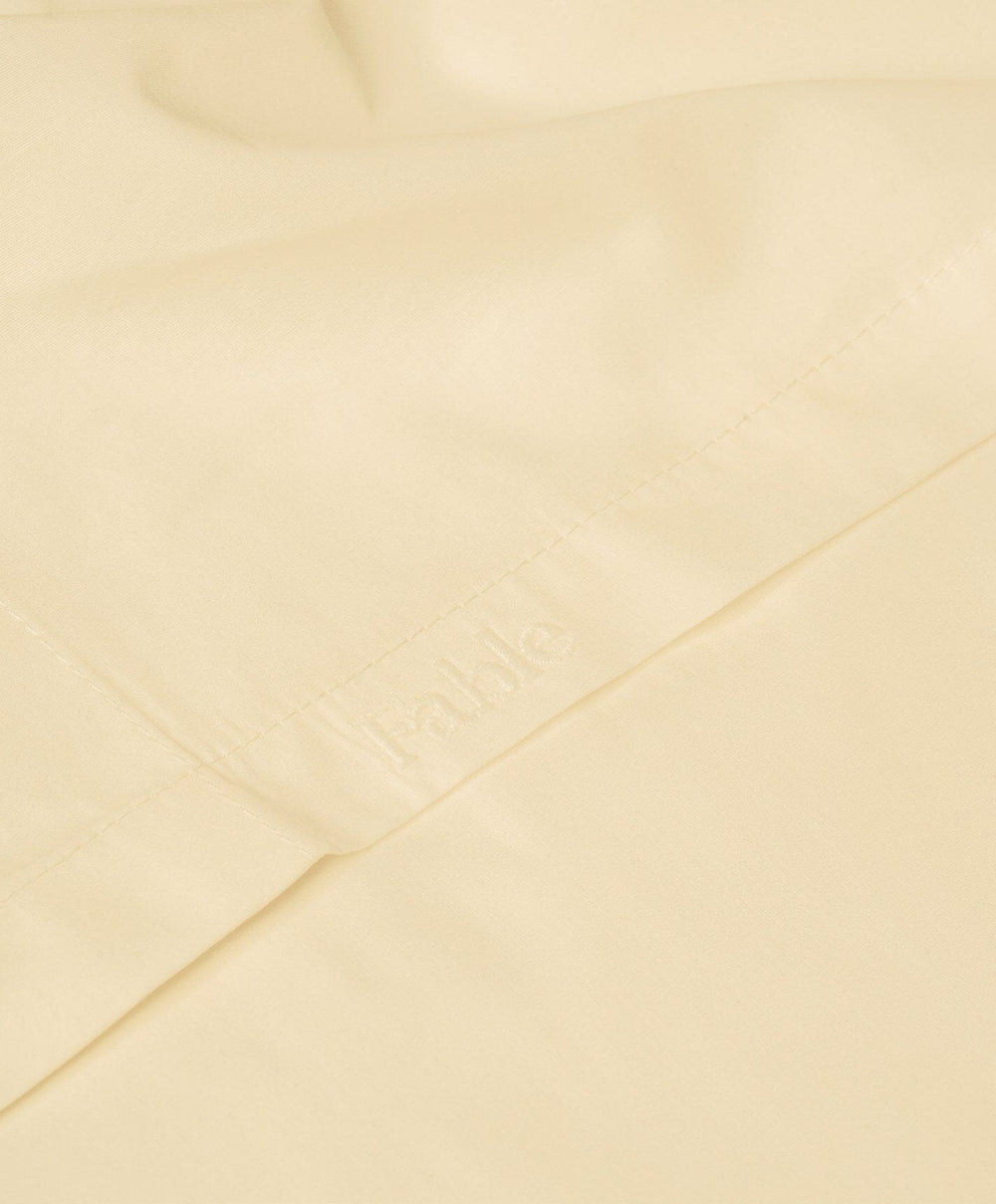 Percale Flat Sheet by Fable Home, shown in Buttercup Yellow.