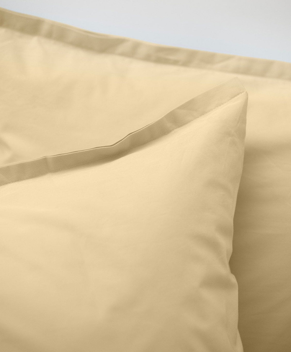 Percale Pillowcase Pair by Fable Home, shown in Buttercup Yellow.