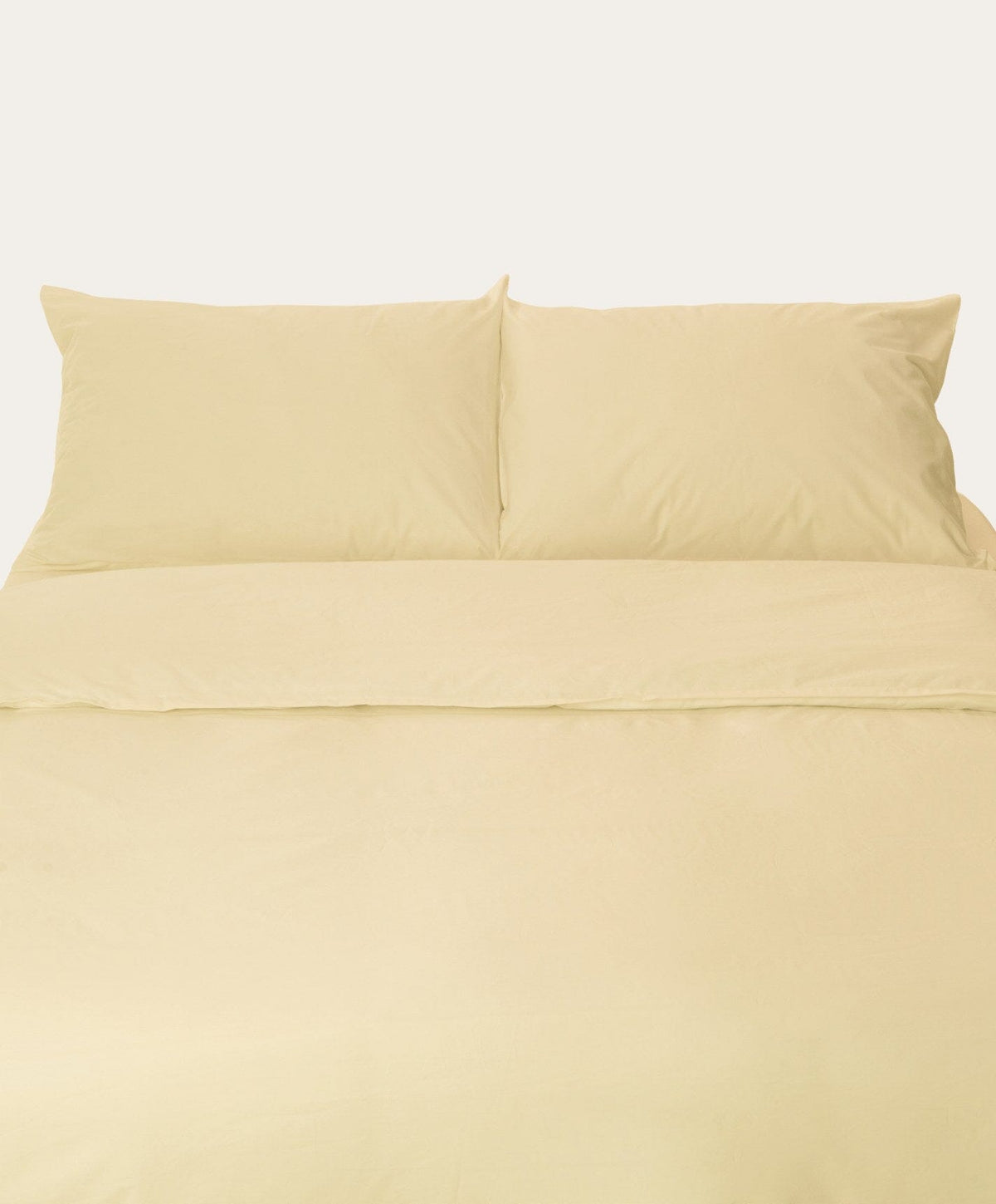 Percale Pillowcase Pair by Fable Home, shown in Buttercup Yellow.