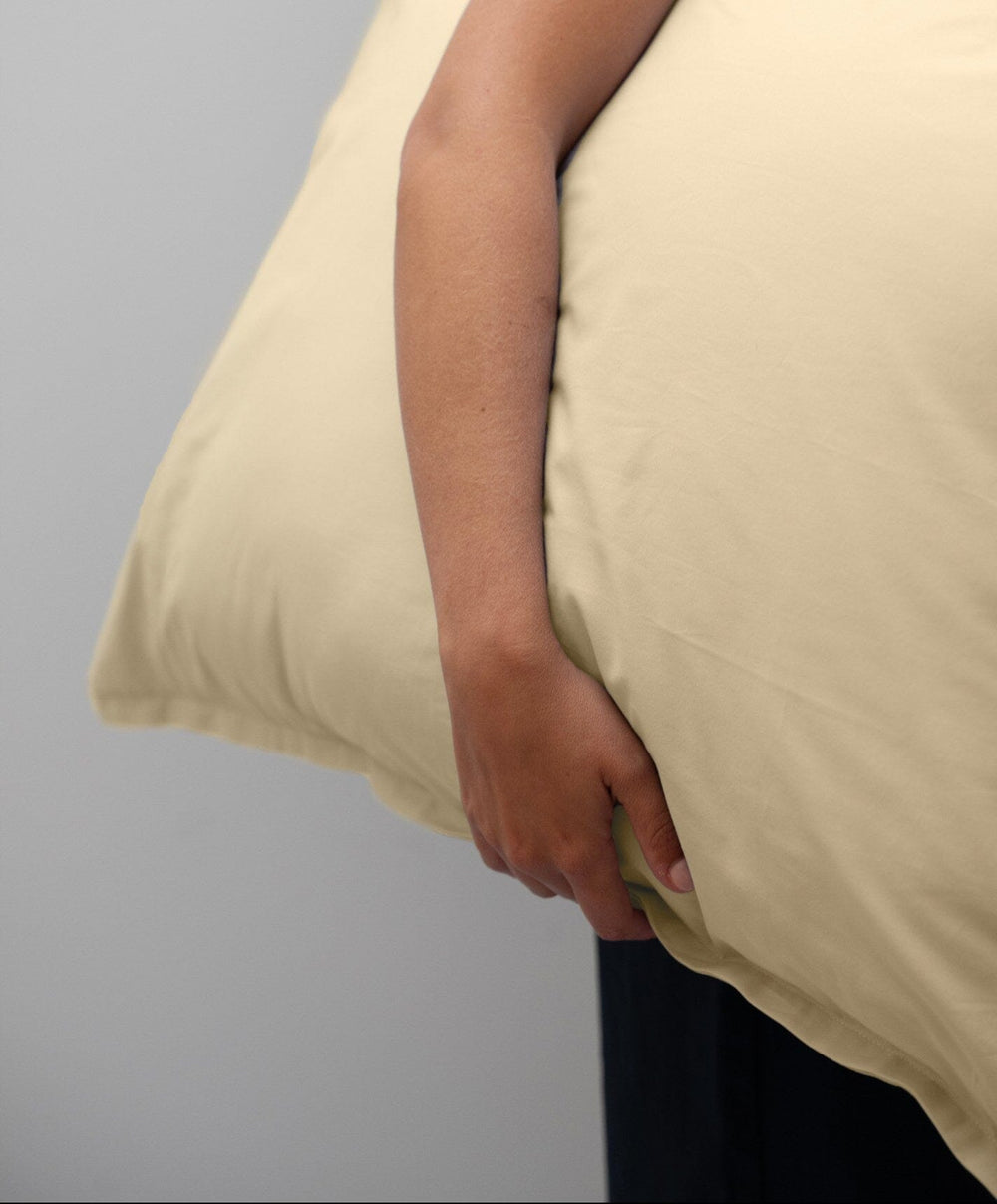 Percale Pillowcase Pair by Fable Home, shown in Buttercup Yellow.