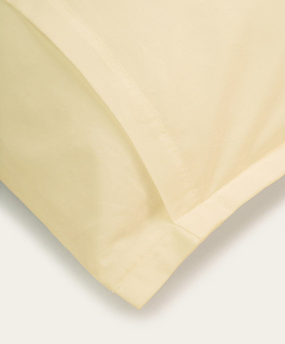 Percale Pillowcase Pair by Fable Home, shown in Buttercup Yellow.