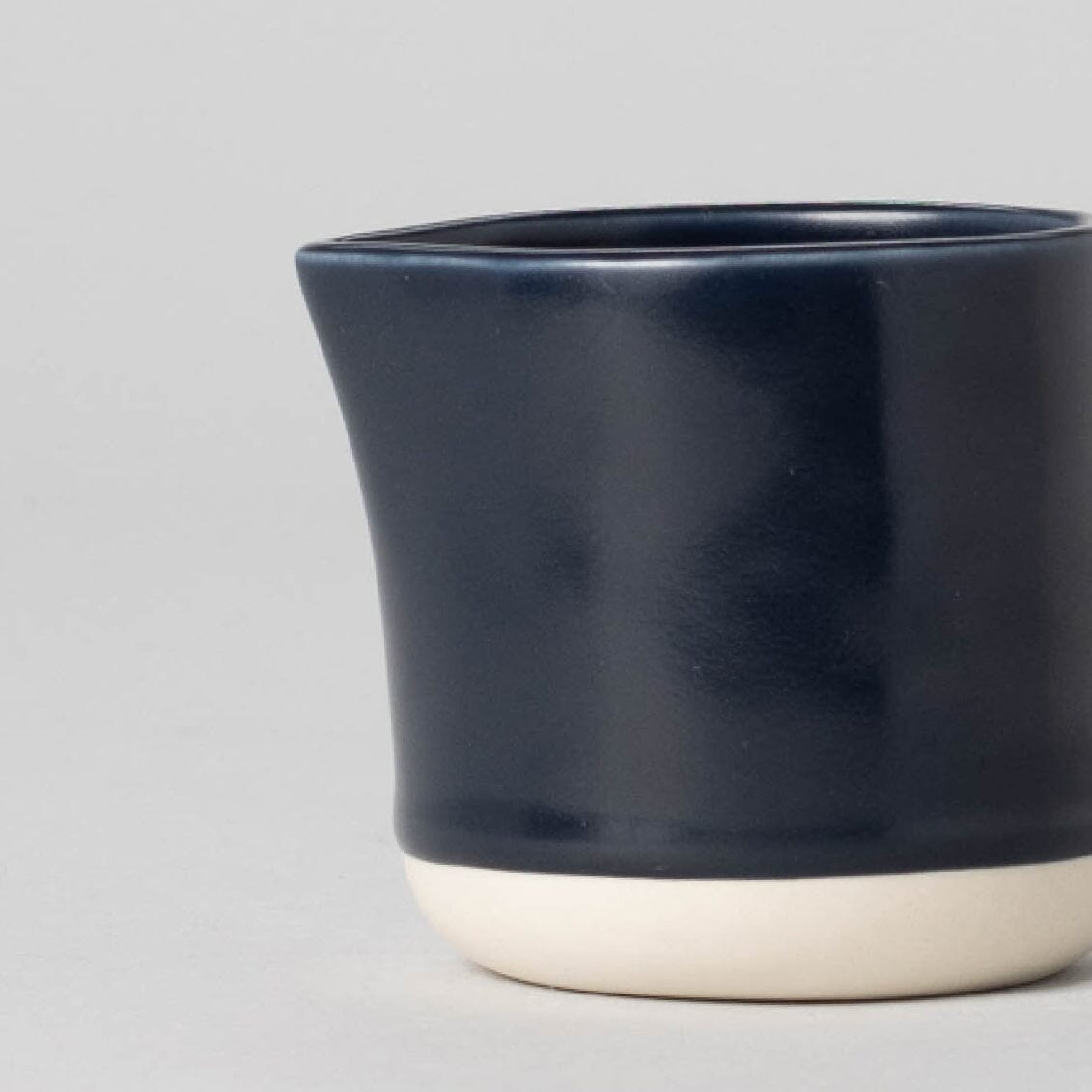 Small carafe drinkware by Fable Home, shown in a midnightblue finish.