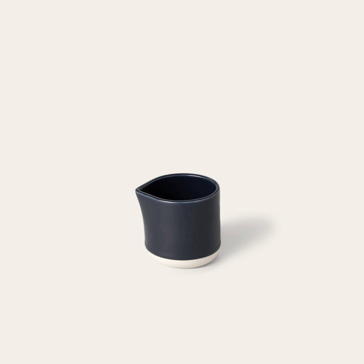 Small carafe drinkware by Fable Home, shown in a midnightblue finish.